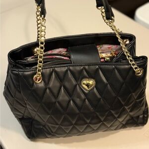Elegant Black Quilted Handbag with Gold Accents